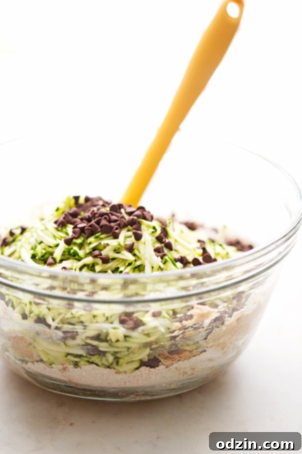 Healthy Zucchini Muffins with Chocolate Chips - A delightful combination of healthy and sweet. Healthy Zucchini Muffins with Chocolate Chips - Golden brown and perfectly baked, ready to be enjoyed.