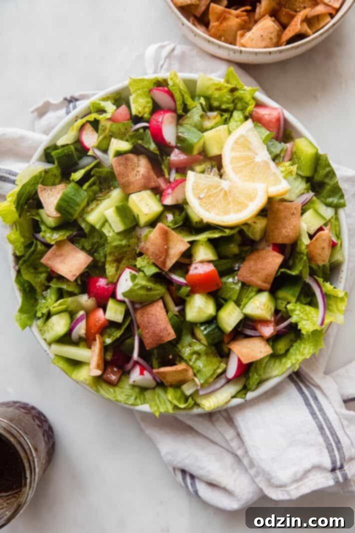 fattoush salad in bowl on white marble
