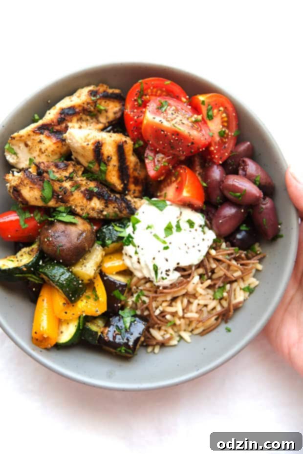 Greek Chicken Souvlaki Bowls with Roasted Veggies - A simple #mealprep meal made with grilled souvlaki chicken tenders, homemade tzatziki sauce, and roasted veggies! SO easy and SO delicious! #greekchicken #grilledchickentenders #chickensouvlakibowls #chickensouvlaki | Littlespicejar.com