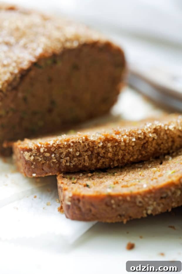 Autumn Spiced Zucchini bread -- made with warm spiced and topped with a crunchy sugar topping. The most delicious loaf you'll make this fall! #zucchinibread #zucchiniloaf #spicedbread | Littlespicejar.com
