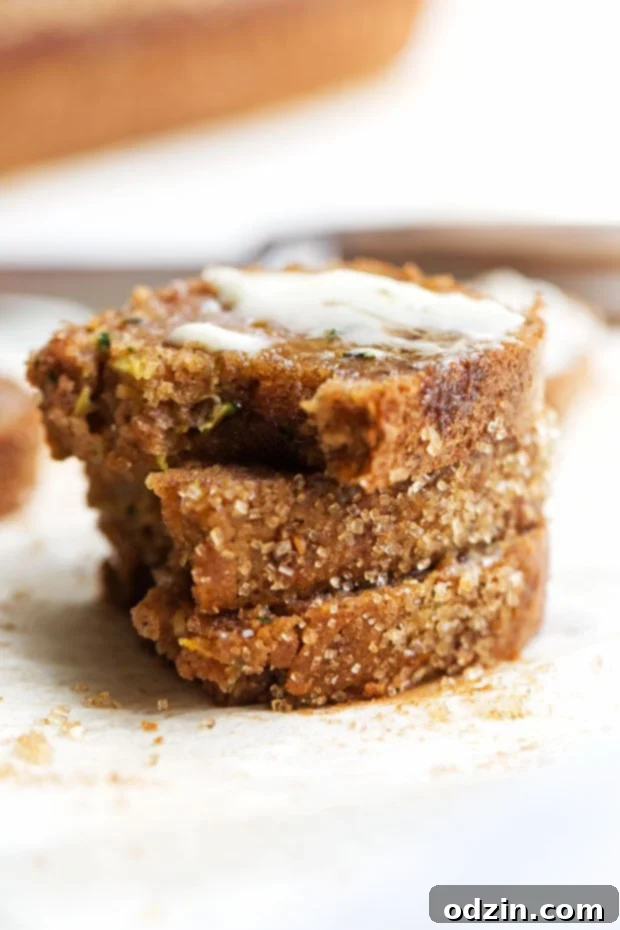 Autumn Spiced Zucchini bread -- made with warm spiced and topped with a crunchy sugar topping. The most delicious loaf you'll make this fall! #zucchinibread #zucchiniloaf #spicedbread | Littlespicejar.com