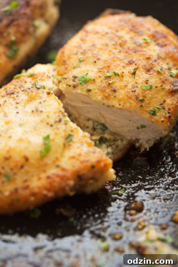 Sun-Dried Tomato and Spinach Stuffed Chicken Breasts - a simple yet elegant recipe for stuffed chicken breasts. Crispy on the outside and cheesy on the inside! #chicken #stuffedchicken #chickenrecipes | Littlespicejar.com