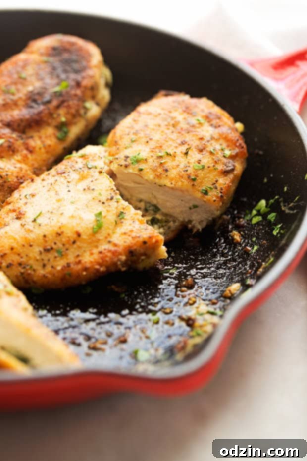 Sun-Dried Tomato and Spinach Stuffed Chicken Breasts - a simple yet elegant recipe for stuffed chicken breasts. Crispy on the outside and cheesy on the inside! #chicken #stuffedchicken #chickenrecipes | Littlespicejar.com