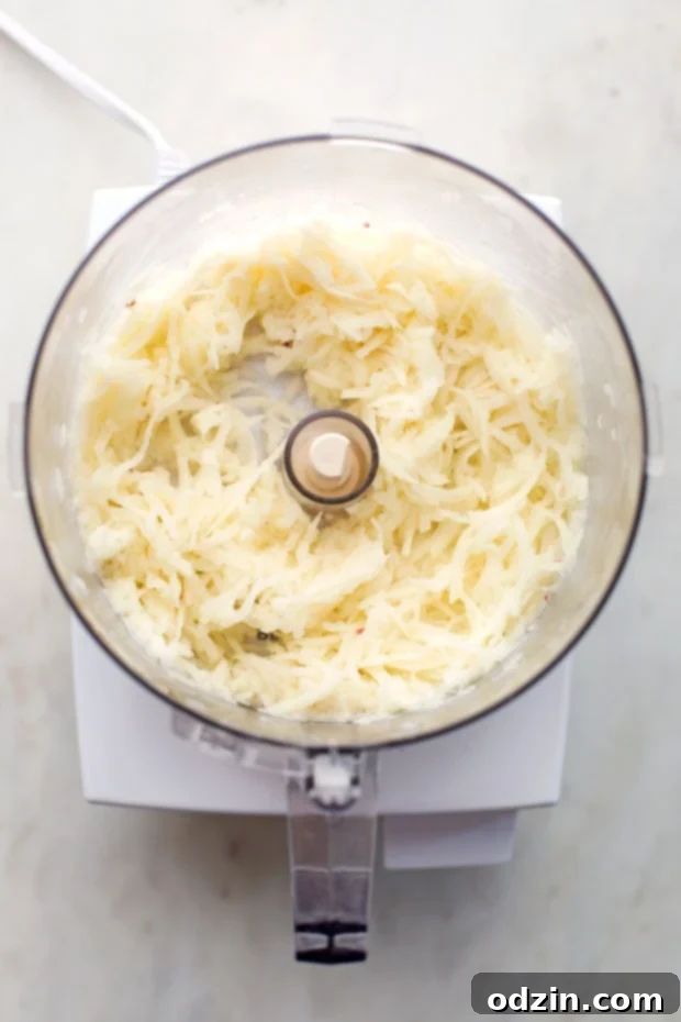 shredded potatoes in the food processor