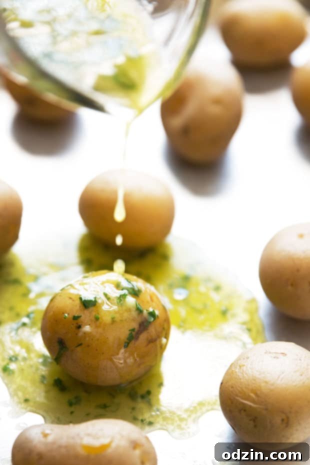 Parmesan Garlic Smashed Potatoes - an easy side dish or the perfect snack for football season! #smashedpotatoes #garlicsmashedpotatoes #potatoskins | Littlespicejar.com