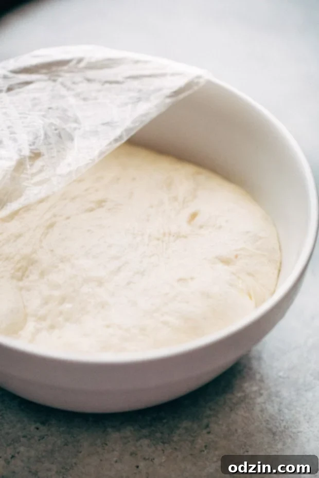 Close-up of a bubbling homemade Philly Cheese Steak Pizza, showcasing melted cheese, thinly sliced steak, and vibrant sautéed vegetables.