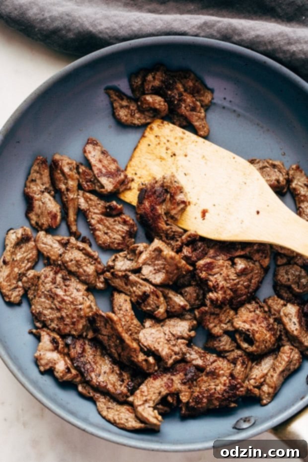 Philly Cheese Steak Pizza ready to be served, highlighting the golden crust and generous toppings.