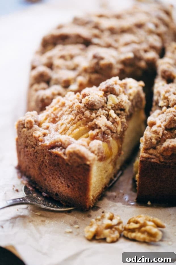 Cinnamon Apple Crumb Cake with a golden brown, chunky streusel topping.