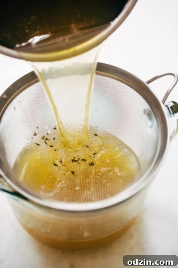 Chicken Broth Cooking in Instant Pot Pressure Cooker Chicken Broth with Whole Chicken and Vegetables