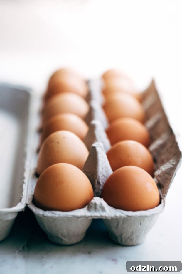 Three baked sweet potatoes, ready to be scooped and mashed for a homemade casserole.