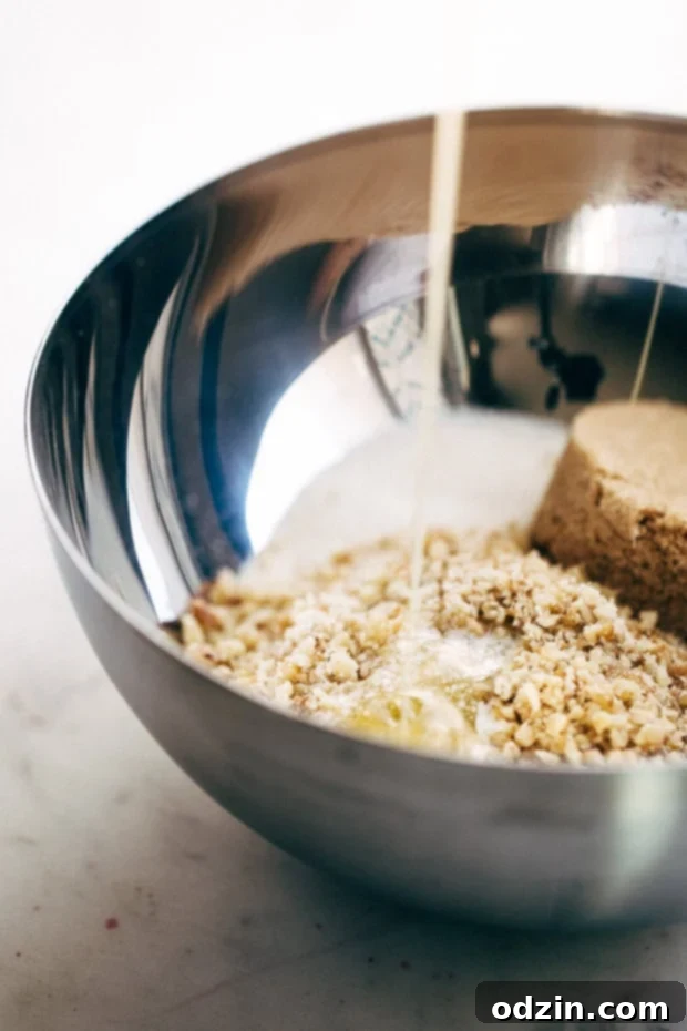 Ingredients for sweet potato casserole topping: brown sugar, granulated sugar, flour, butter, and chopped California Walnuts.