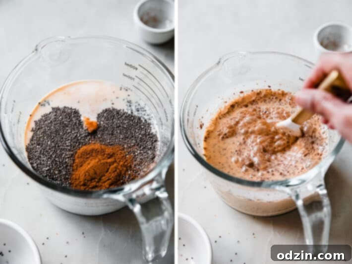 Close-up view of pumpkin chia seed pudding ingredients being mixed in a large measuring cup with a whisk on a clean kitchen counter.